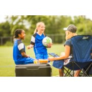 family using coleman outdoor gear at girl's soccer game image number 7