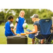family using coleman outdoor gear at girl's soccer game image number 5