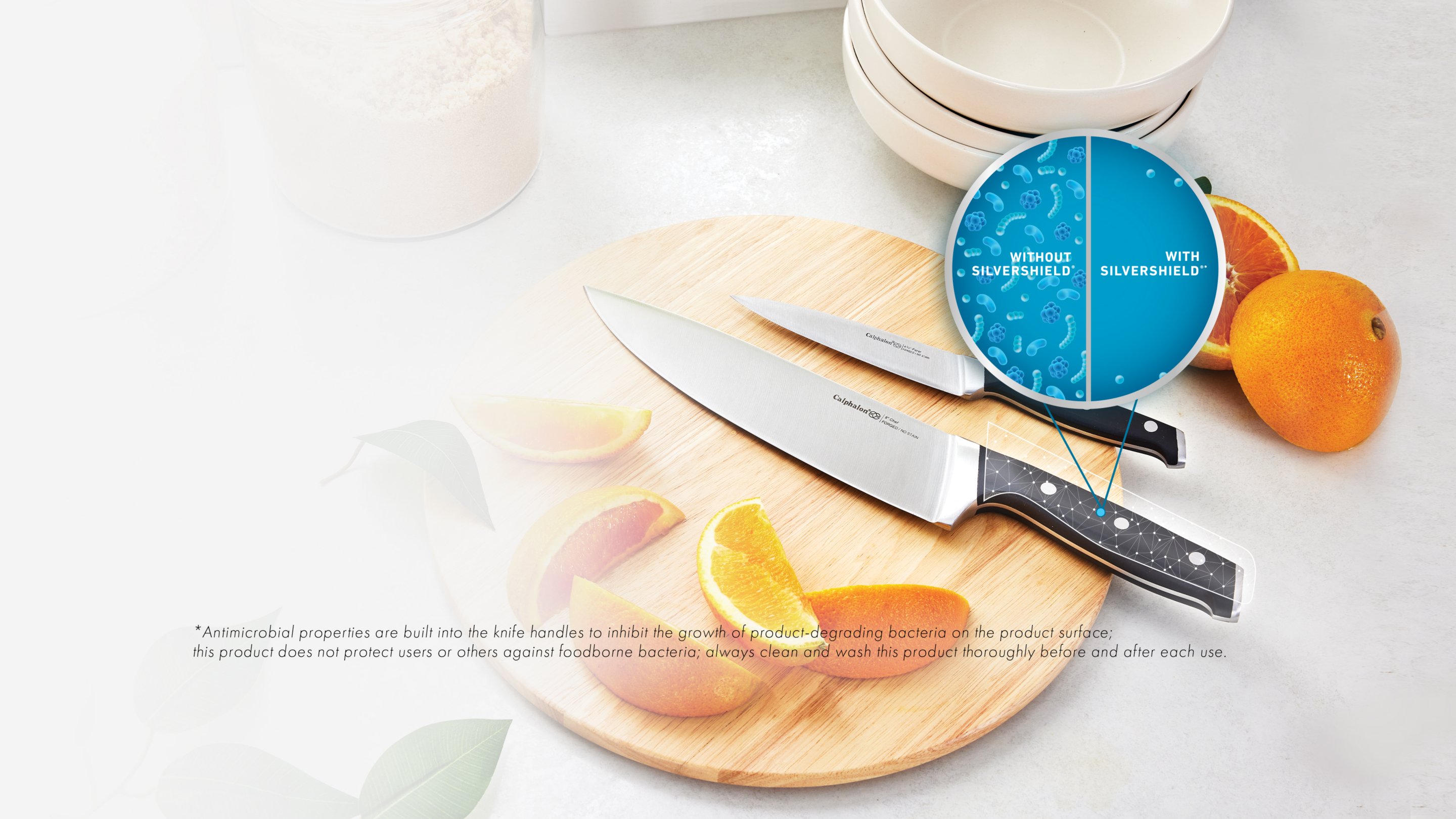 two silvershield™ kitchen knives on cutting board on counter
