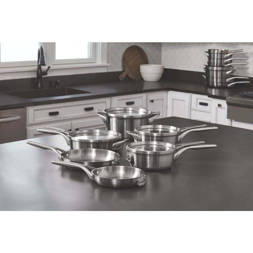 https://newellbrands.scene7.com/is/image/NewellRubbermaid/2010605-calphalon-premier-space-saving-nonstick-cookware-stainless-steel-10pc-set-in-use-5?wid=1000&hei=1000