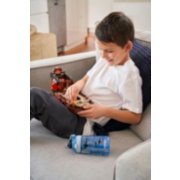 child playing with legos with water bottle laying down on couch next to him image number 7