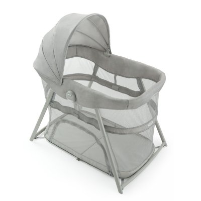 light gray baby playpen with a canopy
