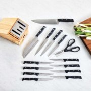 knife set and kitchen shears spread out in front of knife block image number 2