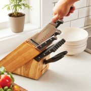 hand removing knife from knife block image number 5
