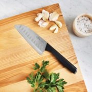 santoku knife on cutting board with garlic and parsley image number 3