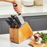 hand removing knife from knife block image number 4