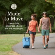 Two people walking with cooler that is made to move image number 2