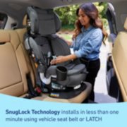 woman installing car seat with SnugLock technology image number 4