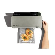 hand using vacuum sealer to seal bag of orange and chicken image number 4
