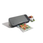 grey and black vacuum sealer sealing bag of spinach and fruit image number 4