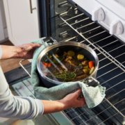Person taking a stockpot out of an oven image number 4