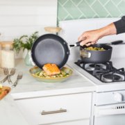 Person serving salmon from a non-stick frying pan image number 5