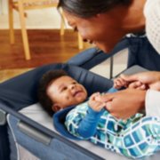 baby in bassinet in pack n play simple solution playard at home image number 4