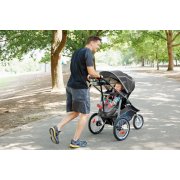 father jogging with child inside 3 wheel jogger modes travel system image number 1
