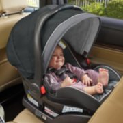 child in snug ride snug lock rear facing car seat inside vehicle image number 6