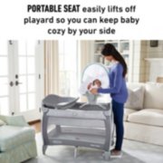 baby in portable seat of close 2 baby pack n play playard image number 1