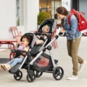 mom with 2 kids in a modes nest 2 grow modular stroller with a second seat image number 3