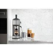 Espresso machine on countertop with mugs and accessories image number 5