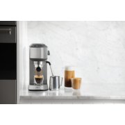 Espresso machine on countertop with mugs and accessories image number 6