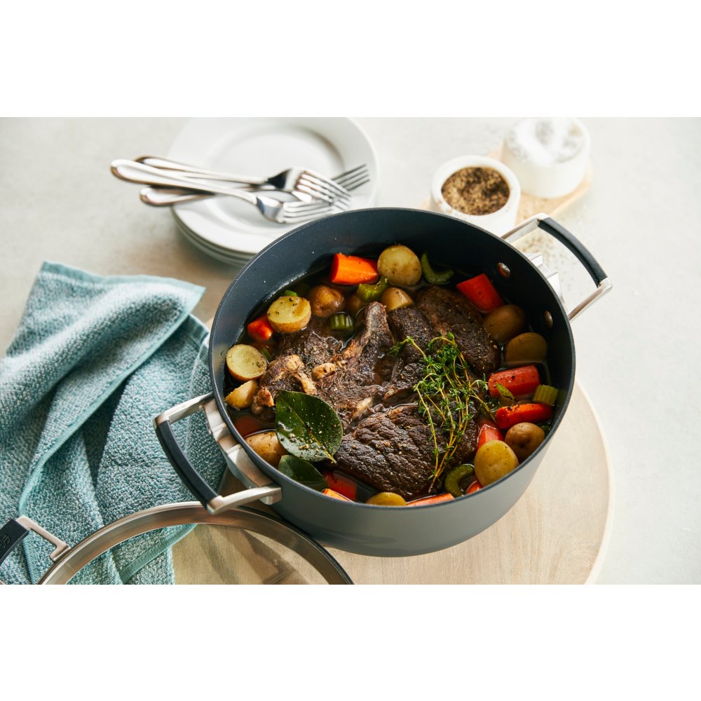 https://newellbrands.scene7.com/is/image/NewellRubbermaid/Calphalon-Cookware-Good-Tier-Tempered-Glass-Lids-Select-Space-Saving-straight-on-slightly-high-with-talnt-with-food-3?wid=1000&hei=1000