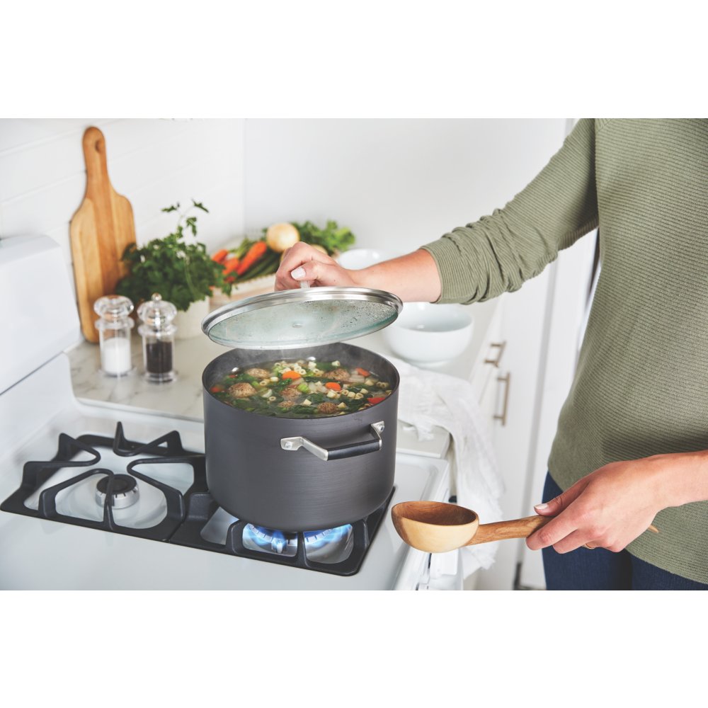 https://newellbrands.scene7.com/is/image/NewellRubbermaid/Calphalon-Cookware-Good-Tier-Tempered-Glass-Lids-Select-StockPot-straight-on-slightly-hig-with-talent-with-food-1?wid=1000&hei=1000