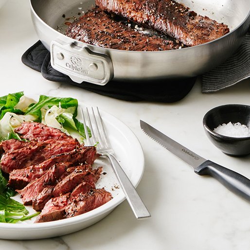 assorted cutlery and cookware with steak dinner