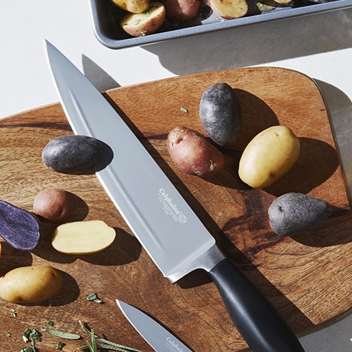 Lifestyle shot of chef knife on a cutting board