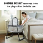 portable bassinet set up beside bed image number 1