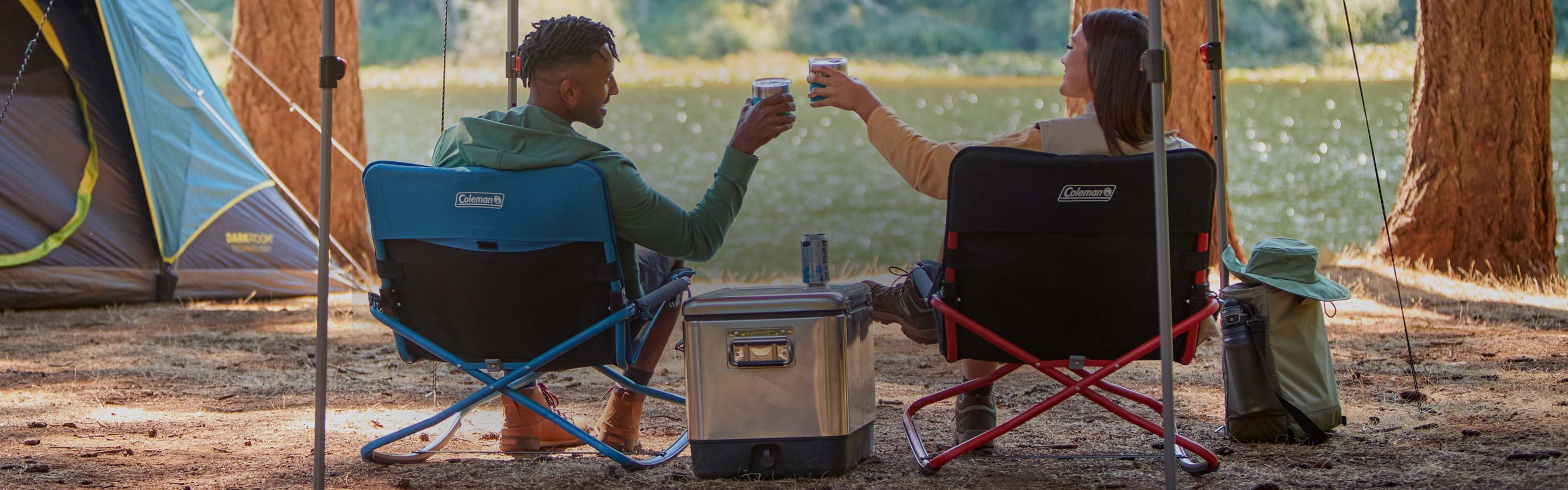 couple toasting at camp site