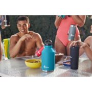 group of people drinking out of assorted size and model reusable water bottles image number 4