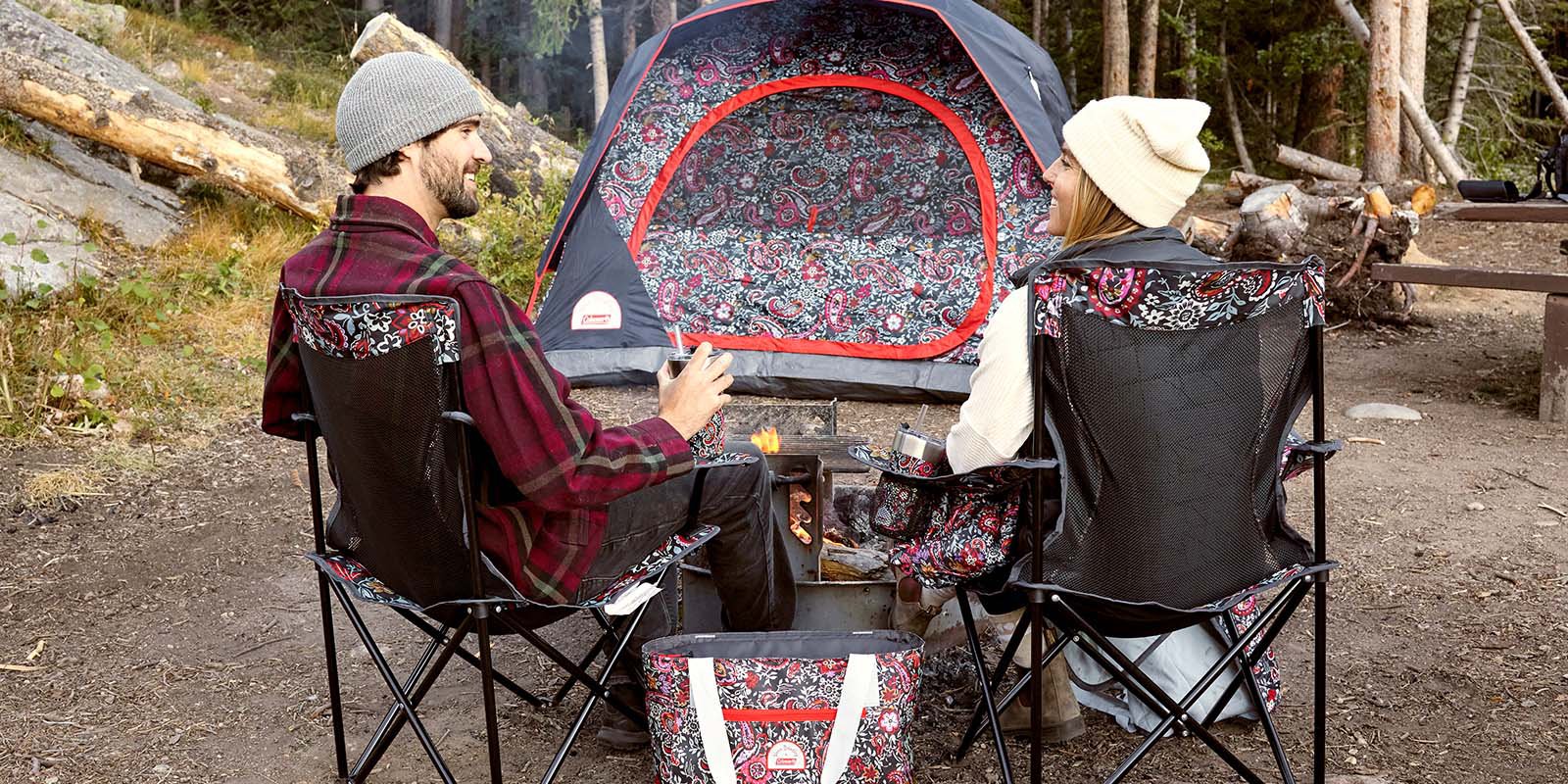 Two people outside with Vera Bradley camping gear