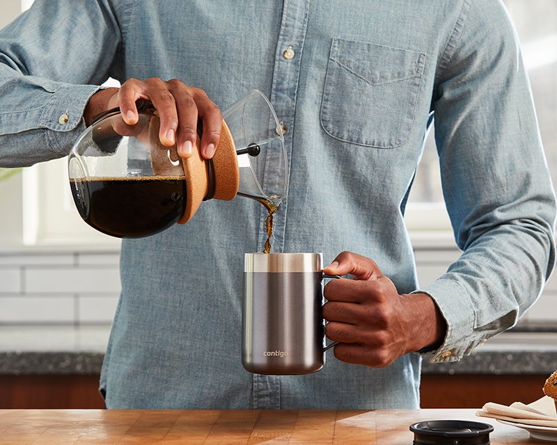 coffee pouring into travel mug