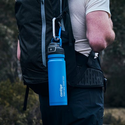 water bottle clipped to backpack for hiking